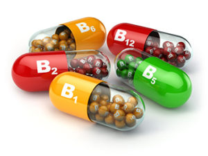 capsules with vitamin letters on them