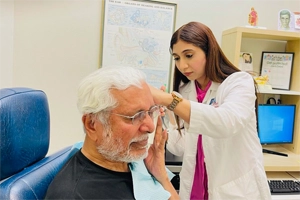 Our Physicians Assistant checking a patients ear